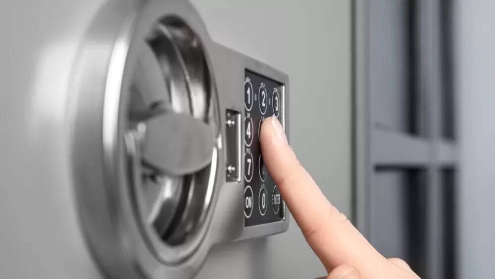 Woman opening steel safe with electronic lock, closeup Safety Deposit Boxes Units in Melbourne